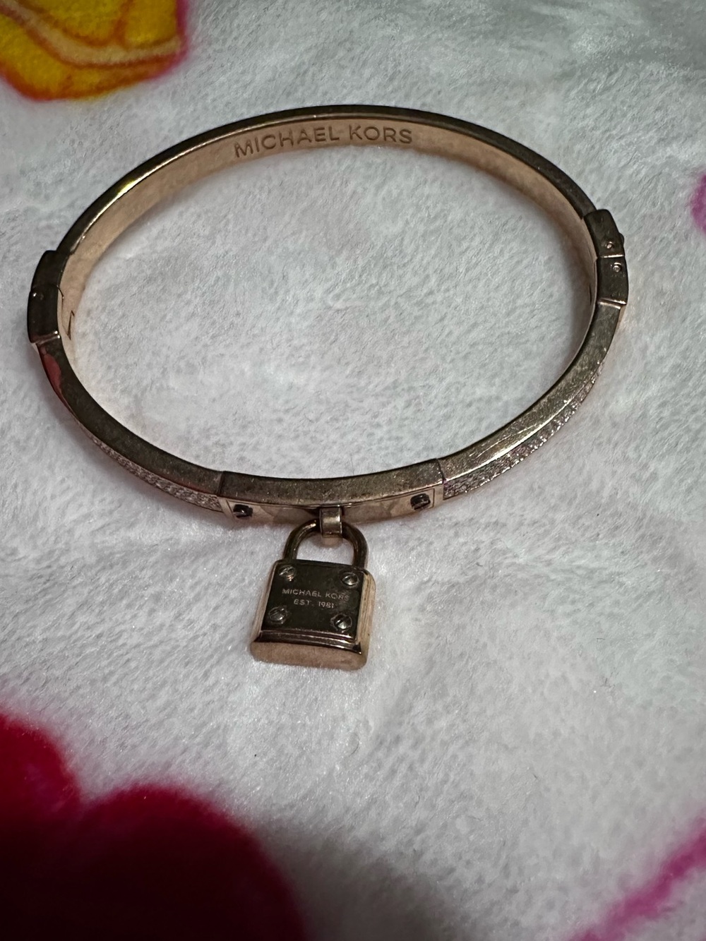 Pre-loved Michael Kors gold plated padlock bracelet with clasp.